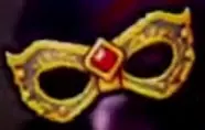 Gold Mask IV with two eye openings and a central red gemstone.